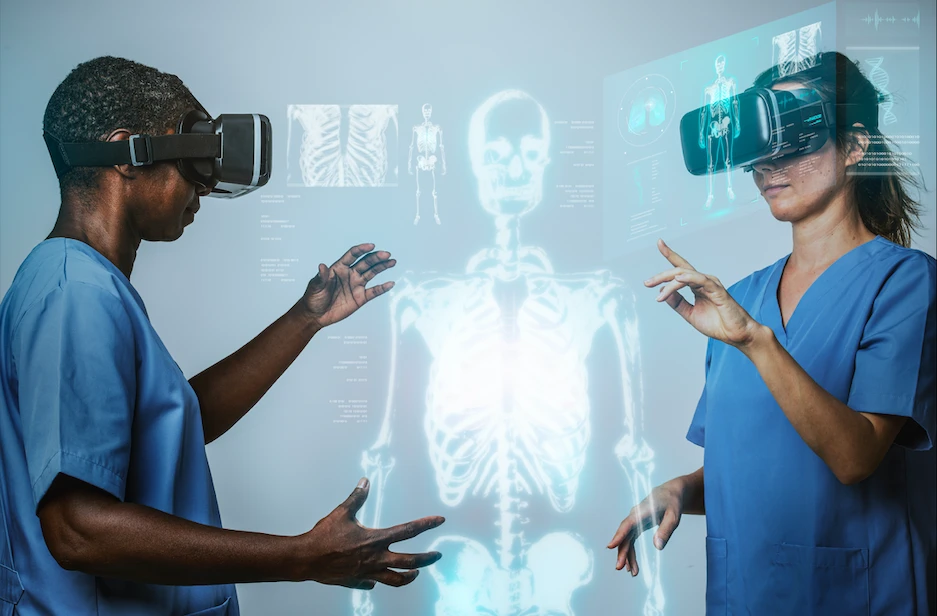 Two doctors are viewing a replica of the human body with 3-D virtual reality glasses as an example of digital twin in healthcare. Two doctors are viewing a replica of the human body with 3-D virtual reality glasses as an example of digital twin in healthcare.